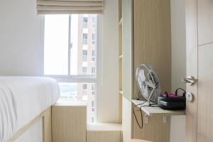 Restful and Cozy 2BR Tokyo Riverside PIK 2 Apartment By Travelio