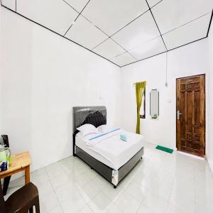 Kempu Tigan Homestay Berastagi Mitra RedDoorz - Ubytování bez kategorie ve městě Berastagi