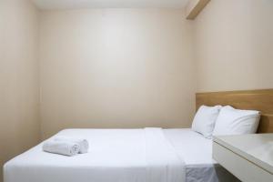 Cozy Living and Tidy 2BR Green Bay Pluit Apartment By Travelio