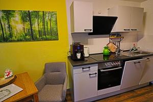 Kaminfeuer Hahnenklee - Ausblick bis zur Stabkirche