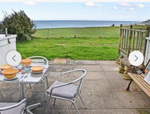 Stunning sea view beach front bungalow Bacton