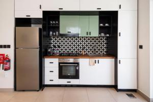 Socio Tower1 - Dubai Hills Modern Urban Retreat in the City by Serenity Living Holiday Homes