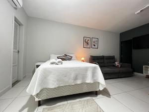 Kitnet Aconchegante em ambiente Familiar a 100m Praia Camburi com Garagem