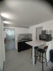 Appartements Charmant studio pour 3 personnes : photos des chambres
