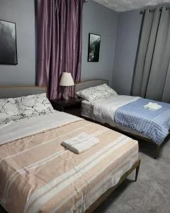 Guest room with two double beds in Columbus Oh, Airport location - Seagrave