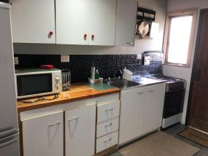 Cabaña a pasos de la costanera con estacionamiento