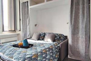 Appartements Le Bouda avec un balcon vue sur la Republique : photos des chambres