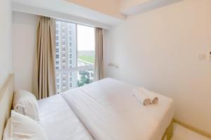 Great Deal and Homey 2BR Tokyo Riverside PIK 2 Apartment By Travelio