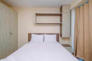 Comfortable and Warm 2BR at Tifolia Apartment By Travelio