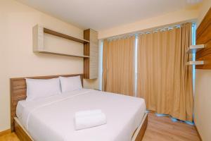 Comfortable and Warm 2BR at Tifolia Apartment By Travelio
