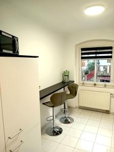 Seyfarthrooms - Ferienwohnung Zum Dorfladen Rathen - zentrale Lage mit direkter Anbindung an das Wanderwegenetz, moderne Inneneinrichtung