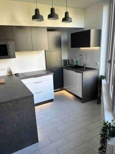 Appartements Le XV Au coeur de la ville : photos des chambres