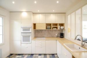 Villas Charmante maison avec piscine : photos des chambres
