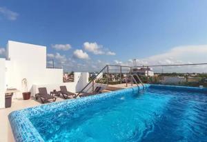 Piscina en la cima Lujoso apartamento en Playa del Carmen