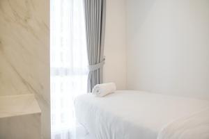 Well Furnished and Homey 2BR Tokyo Riverside PIK 2 Apartment By Travelio