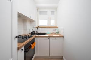 Aleja Waszyngtona Deluxe Apartment by BookingHost