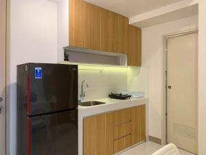 Warm and Cozy Living 2BR Tokyo Riverside PIK 2 Apartment By Travelio