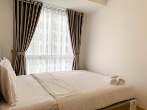 Warm and Cozy Living 2BR Tokyo Riverside PIK 2 Apartment By Travelio