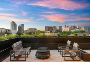 Chic Music Row Condo Rooftop Deck with City View Gym Office and More