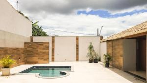 NossoApê Guarua: Piscina | Churrasqueira | Ar-condicionado