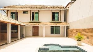 NossoApê Guarua: Piscina | Churrasqueira | Ar-condicionado