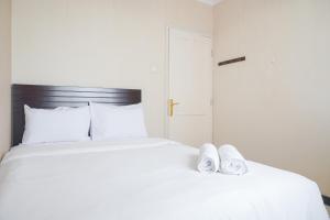 Cozy and Simply Look 2BR at 12nd Floor Puri Garden Apartment By Travelio