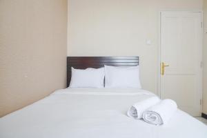 Cozy and Simply Look 2BR at 12nd Floor Puri Garden Apartment By Travelio