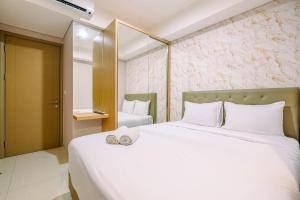 Comfort and Modern 1BR at Gold Coast Apartment By Travelio