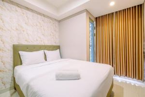 Comfort and Modern 1BR at Gold Coast Apartment By Travelio