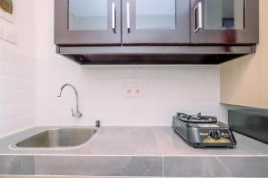 Homey and Relaxing Studio Tokyo Riverside PIK 2 Apartment By Travelio