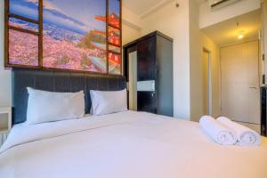 Homey and Relaxing Studio Tokyo Riverside PIK 2 Apartment By Travelio