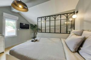 Appartements The Duplex spa Paris : photos des chambres