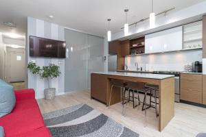 Sleek Kitchen Island And Garden Views