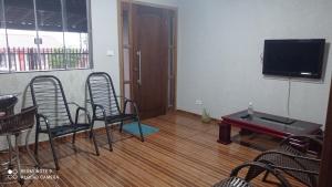 Casa Confortável arejada ar condicionado quente e frio 2 quartos ,2 banheiros ,2 vagas de garagem