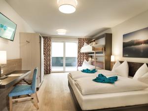 Family Room with Balcony 2 Adults + 2 Children room in Hotel Sportwelt
