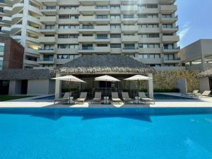 Departamento acogedor con vista al mar y alberca