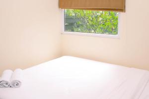 Nice and Strategic 2BR at Green Pramuka City Apartment By Travelio