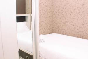 Nice and Strategic 2BR at Green Pramuka City Apartment By Travelio