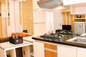 Nice and Strategic 2BR at Green Pramuka City Apartment By Travelio