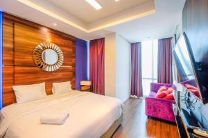 Homey Penthouse 3BR with Extra Room Kemang Village Apartment By Travelio