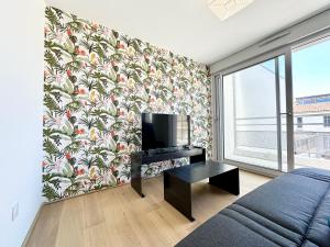 Appartements Sous Les Tropiques - Clim - Parking - Central : photos des chambres
