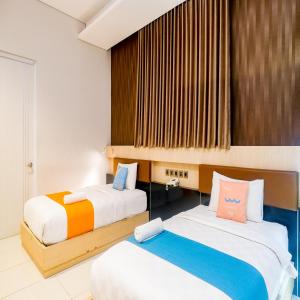 Phòng Hai Giường Đơn Loại Sang (Deluxe Twin Room)