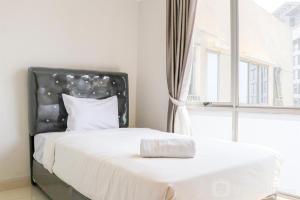 Homey and Modern 2BR at The Mansion Kemayoran Apartment By Travelio