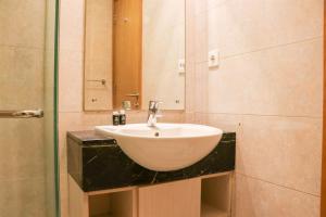 Homey and Modern 2BR at The Mansion Kemayoran Apartment By Travelio