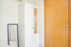 Homey and Modern 2BR at The Mansion Kemayoran Apartment By Travelio