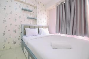 Comfy and Strategic 2BR Apartment at Bassura City By Travelio