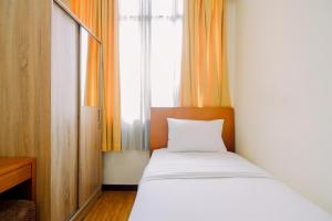 Modern Look and Comfy 3BR Apartment Bellagio Residence By Travelio