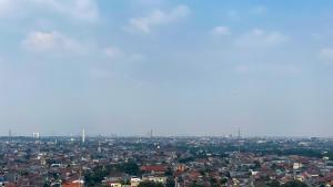 Restful 2BR Bassura City Apartment near Shopping Mall By Travelio