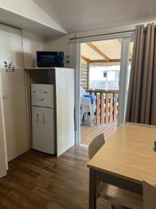 Campings Chez Nathalie mobil home chauffe et climatise : photos des chambres