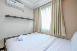 Cozy Stay 1BR at Sky Terrace Apartment By Travelio